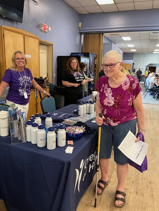 Consumer at KFalls WEAD event - purple shirt and cane.jpg